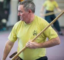 Student performing a Kung Fu staff form