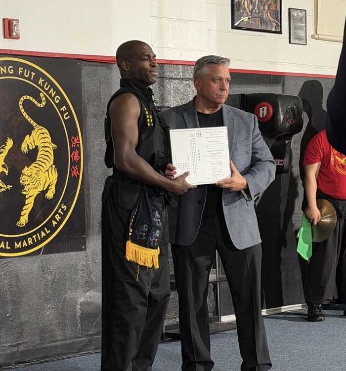 Master Philippe Prosper receiving his Hung Fut 9th Generation Degree of Master certificate